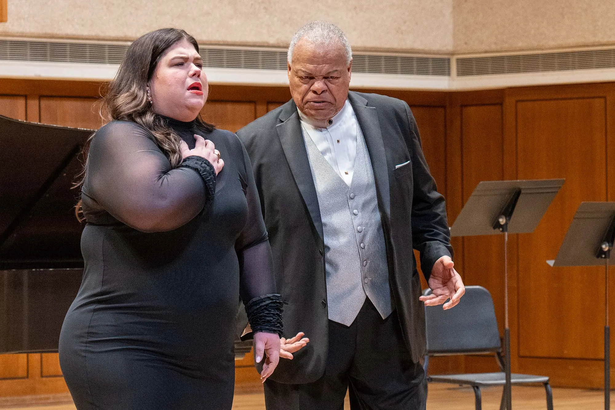 Two opera singers sing on stage