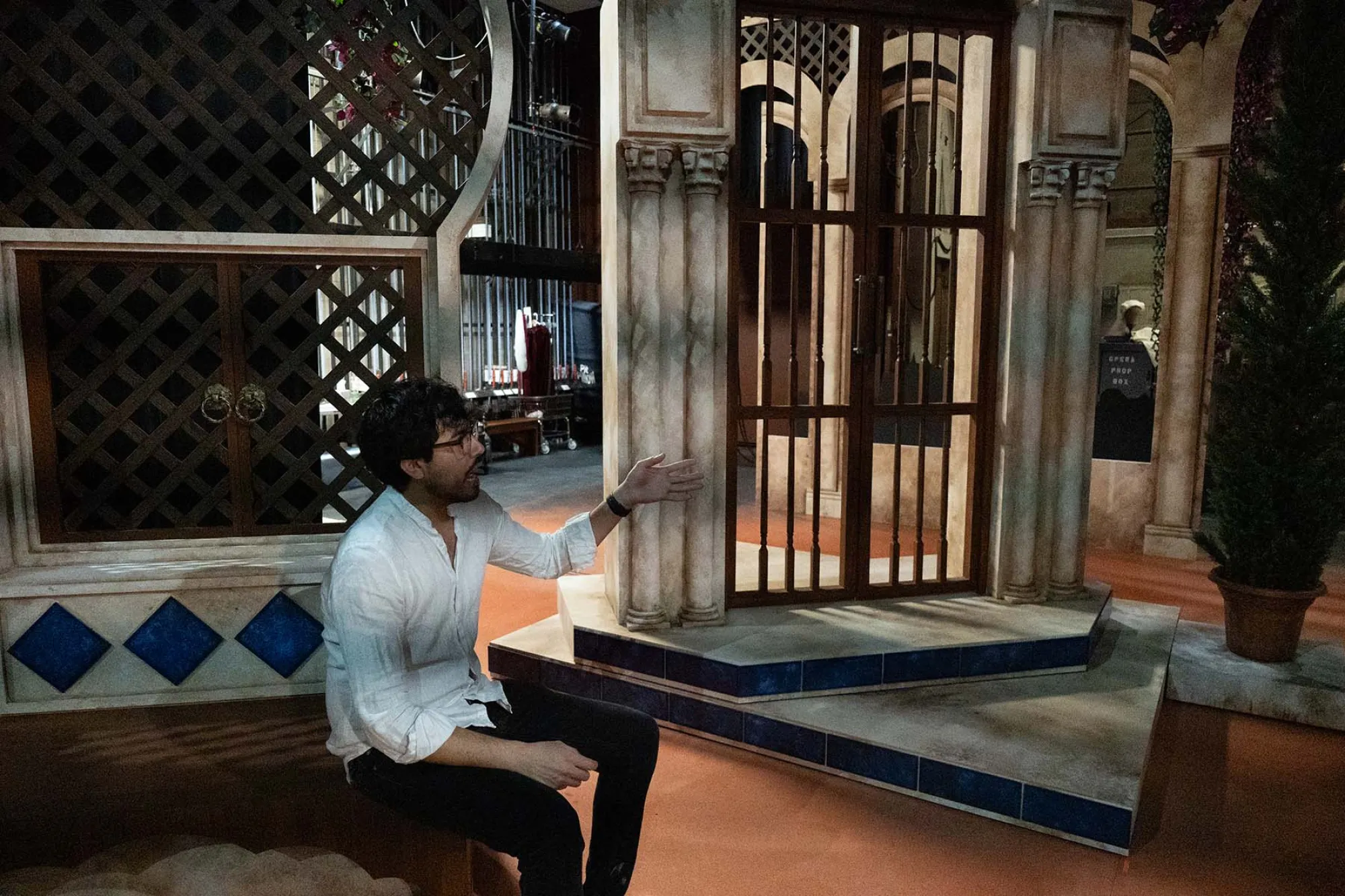 Daniel Ruiz Bustos sits backstage with sets
