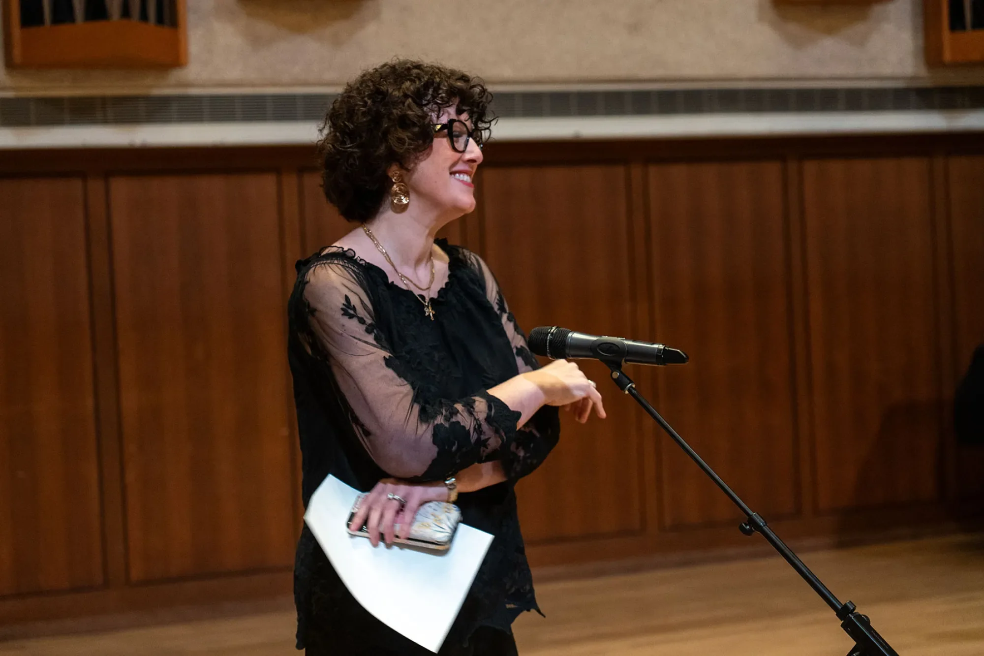 Tamar Sanikidze talking into a mic on stage