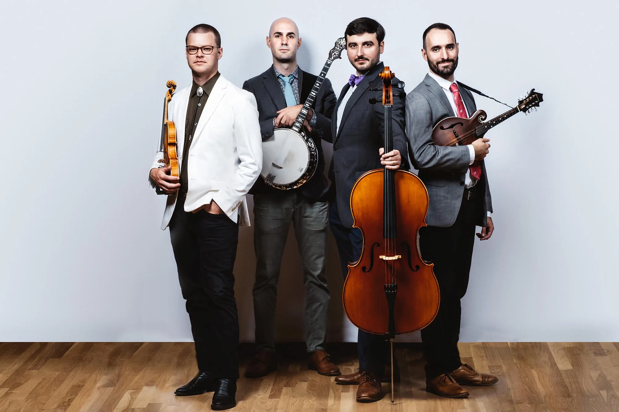 a photo of Invoke quartet holding their instruments