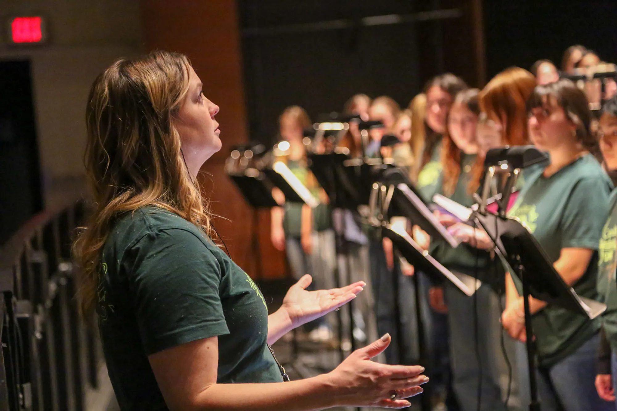 Lisa Holt conducting a choir