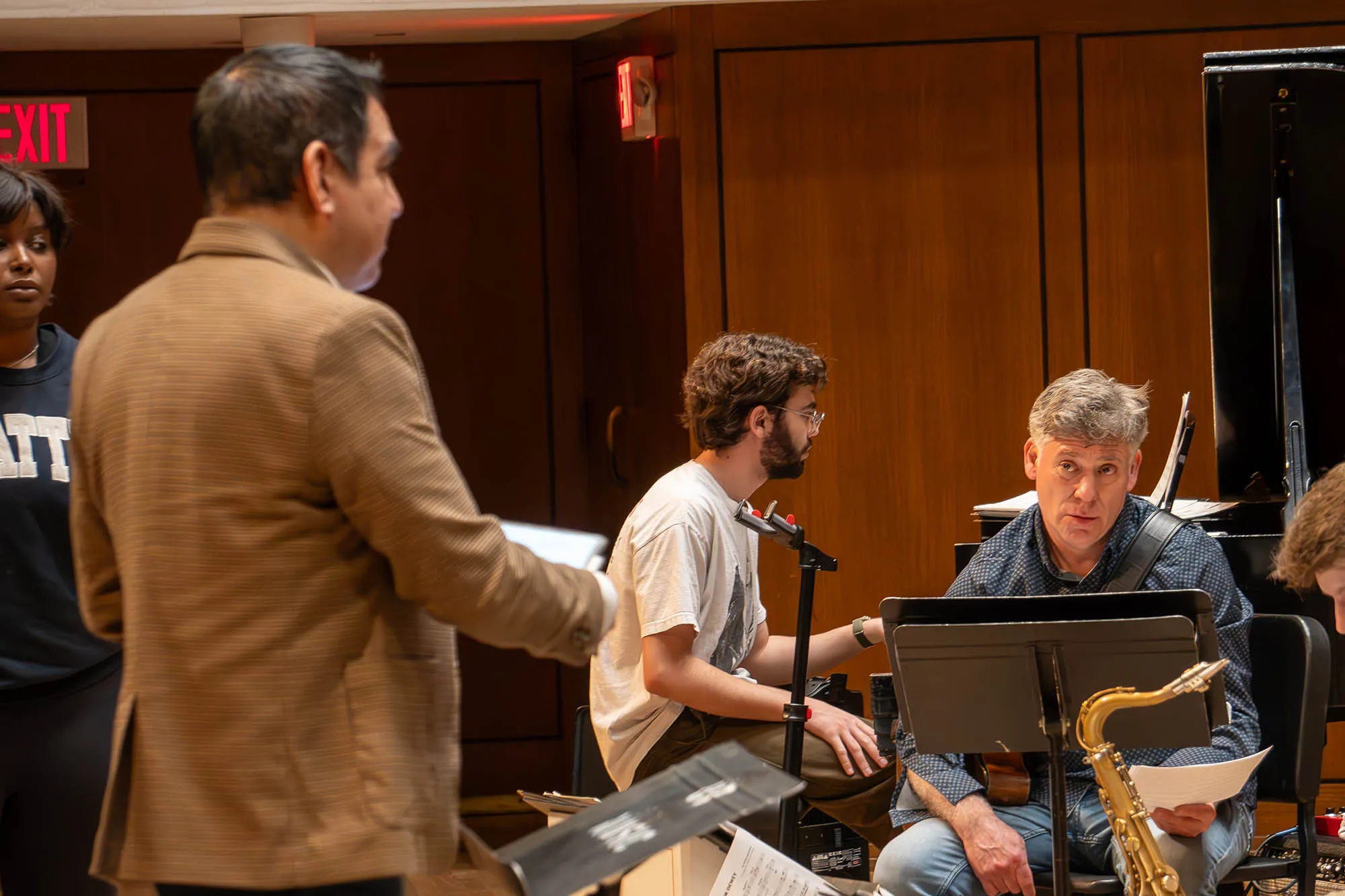 Guitarist Peter Bernstein and Diego Rivera talk on stage during a rehersal