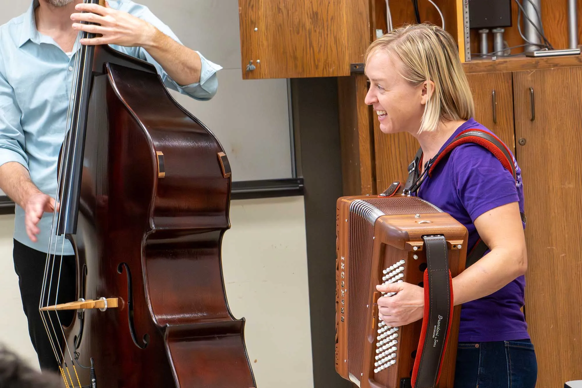 Chelsea Burns playing acordian