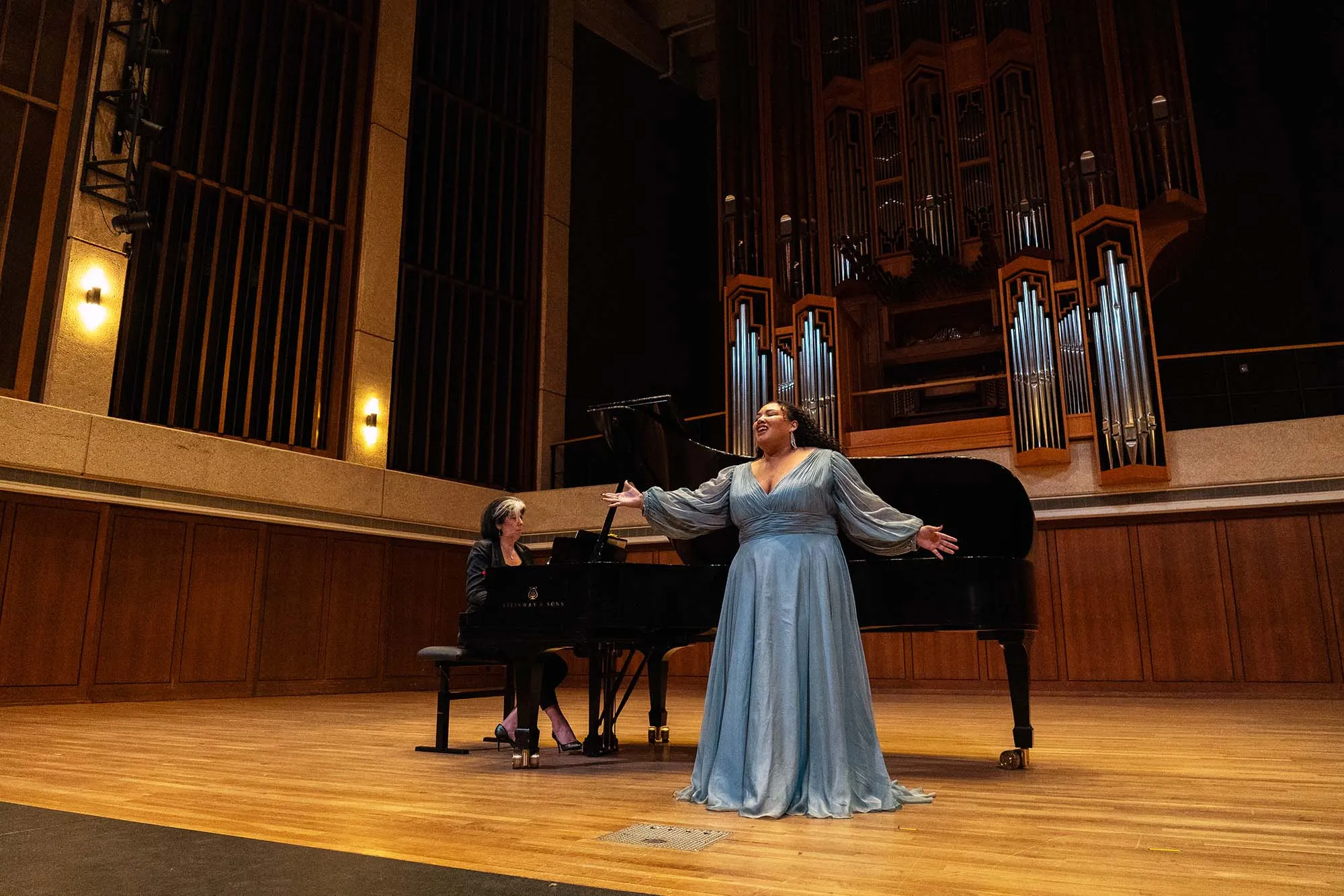 An opera singer singing on stage