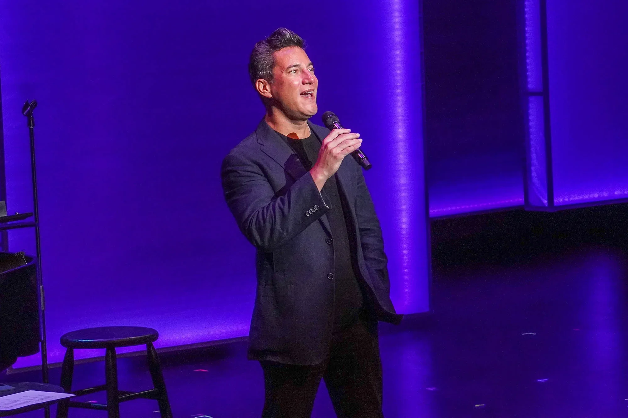 Nicholas Rodriguez singing on stage