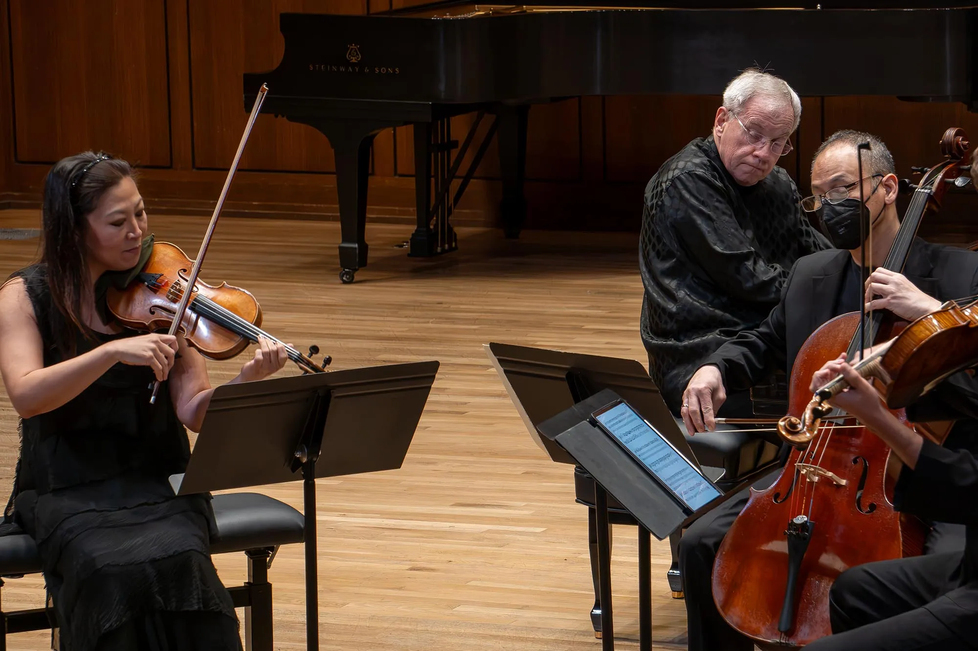 Chamber musicians perform on stage