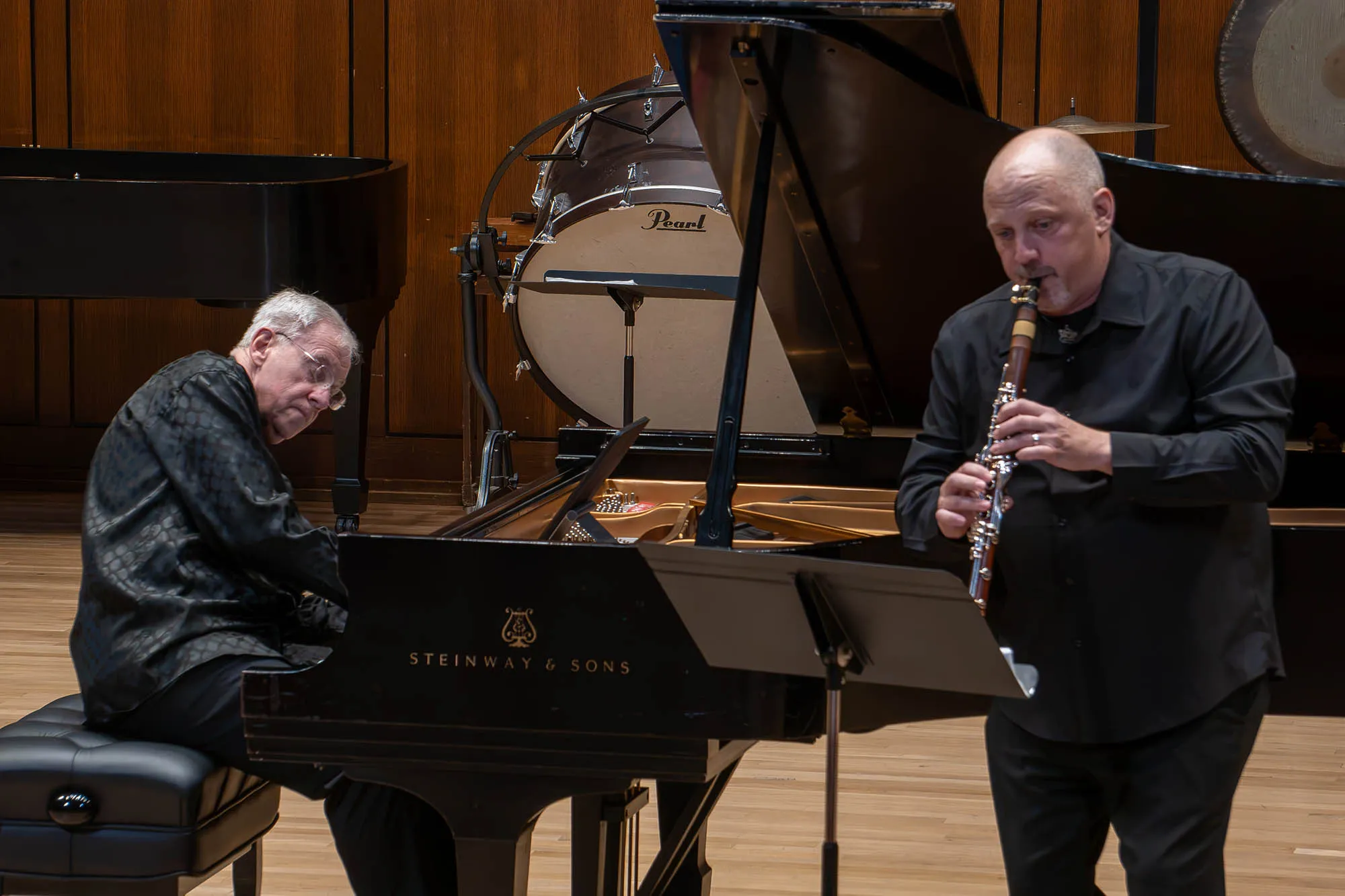 Anton Nel plays piano with clarinetist Jonathan Gunn on stage