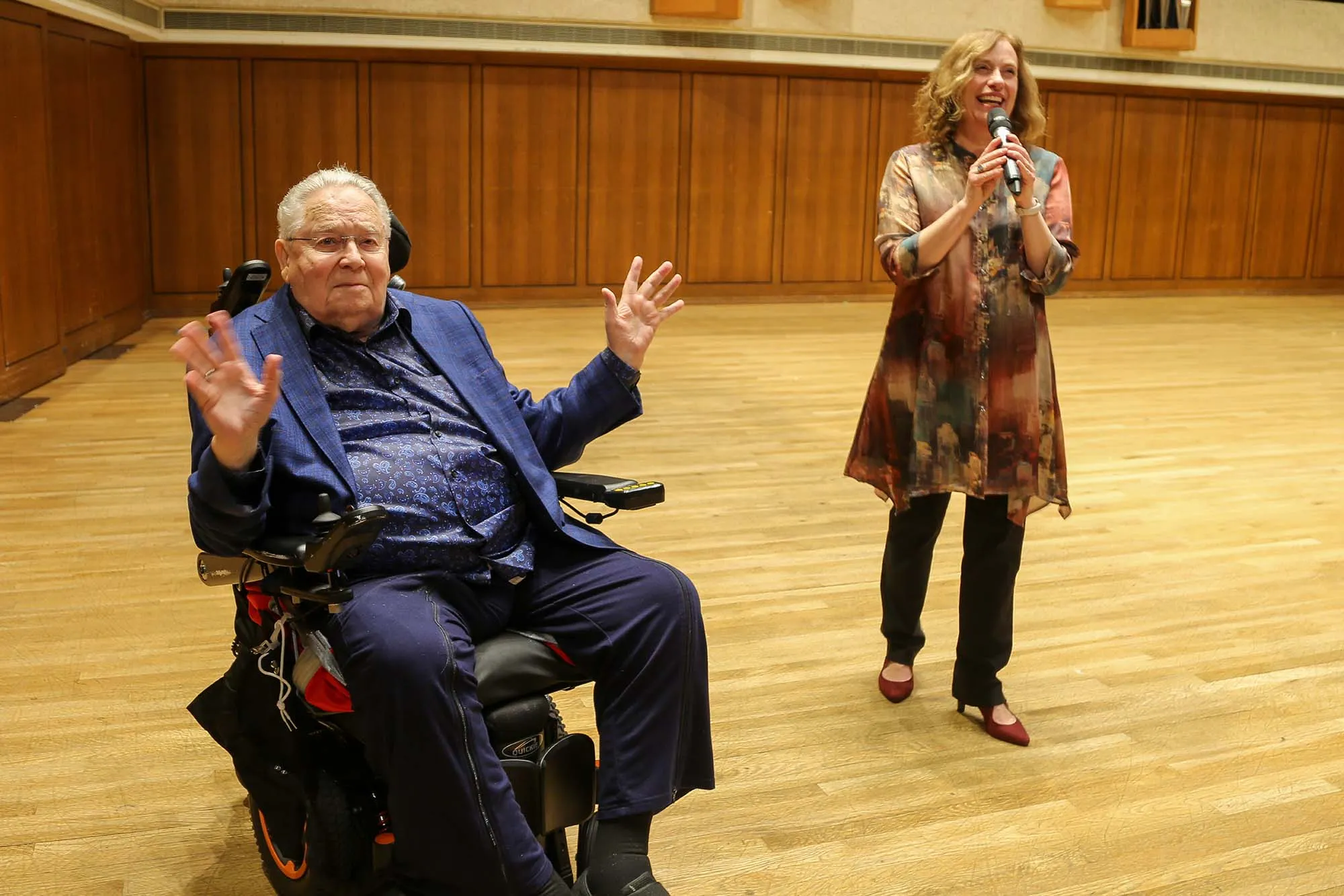 Joe Long and Susan Thomas laughing on stage