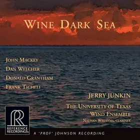 Album cover; a dark blue sea scape at sunset