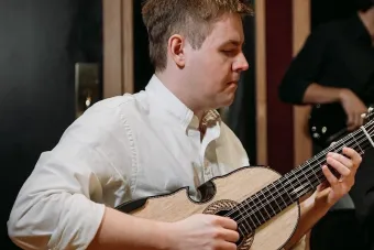 John Bimbiras playing instrument