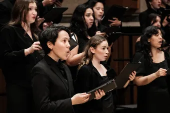 The soprano section of UT Concert Chorale singing in concert.