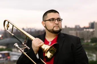 Altin Sencalar portrait holding a trumpet