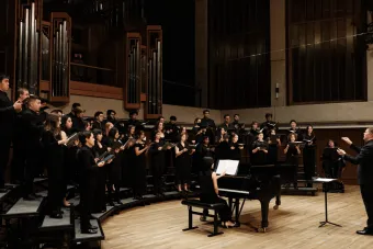 Concert Chorale performs on Bates Recital Hall stage.