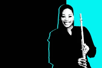 Black and white photo of Ebonee Thomas holding her flute in front of a black and aqua background.