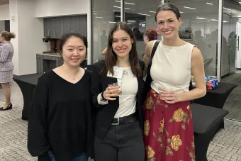 Three women smiling at the camera