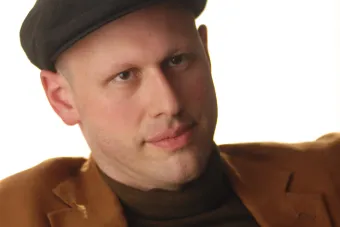 Yevgeniy Sharlat on a white background