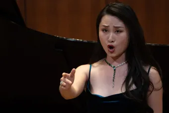Opera Singer singing on stage at the Butler Opera International Competition