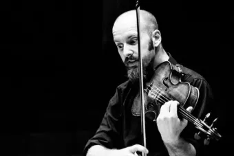 Russell Podgorsek playing a violin