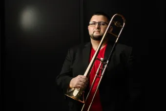 Altin Sencalar poses with his trombone