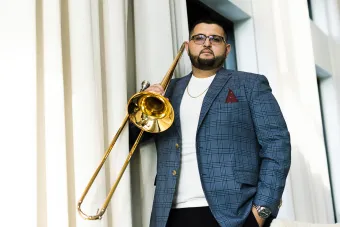 Altin Sencalar poses with his trombone