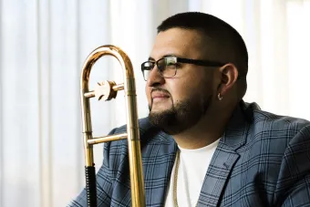 Altin Sencalar poses with his trombone