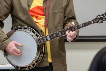 A person playing a banjo