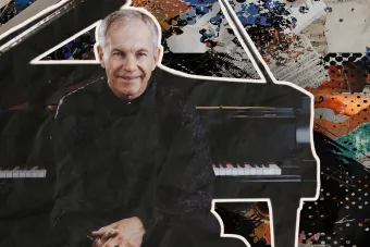 A Headshot of Anton Nel, with the piano behind him. 