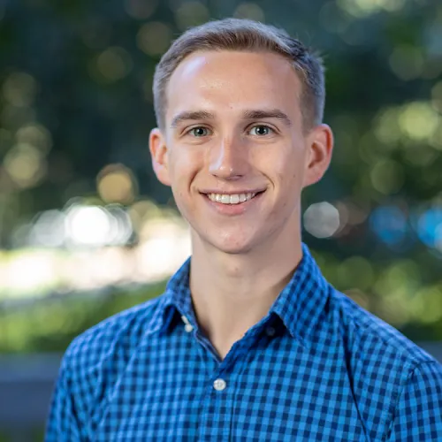 A headshot of AJ Marks