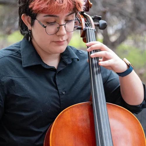 Rey Caneles playing the cello