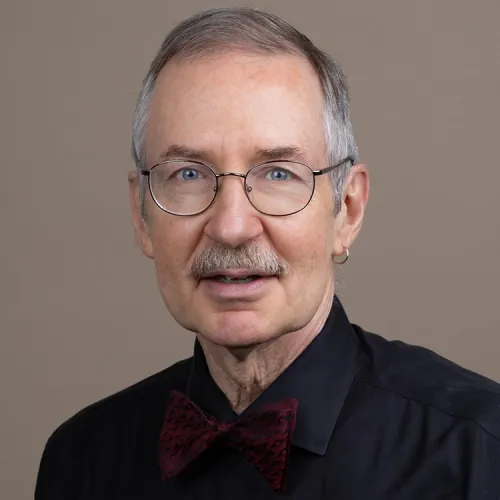 A headshot of Gregory Eaton