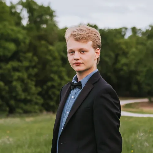 A headshot of Aiden Flora
