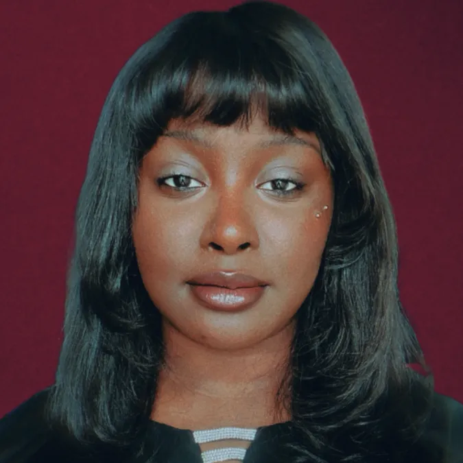 a headshot of Genesis Staple