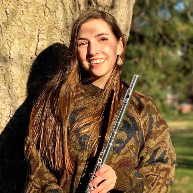 a headshot of Kristen Townander with her flute