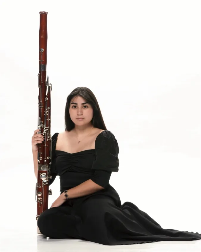 Isabella Perez poses with her bassoon