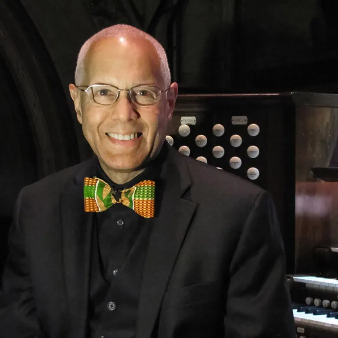 David Hurd sits in front of an organ