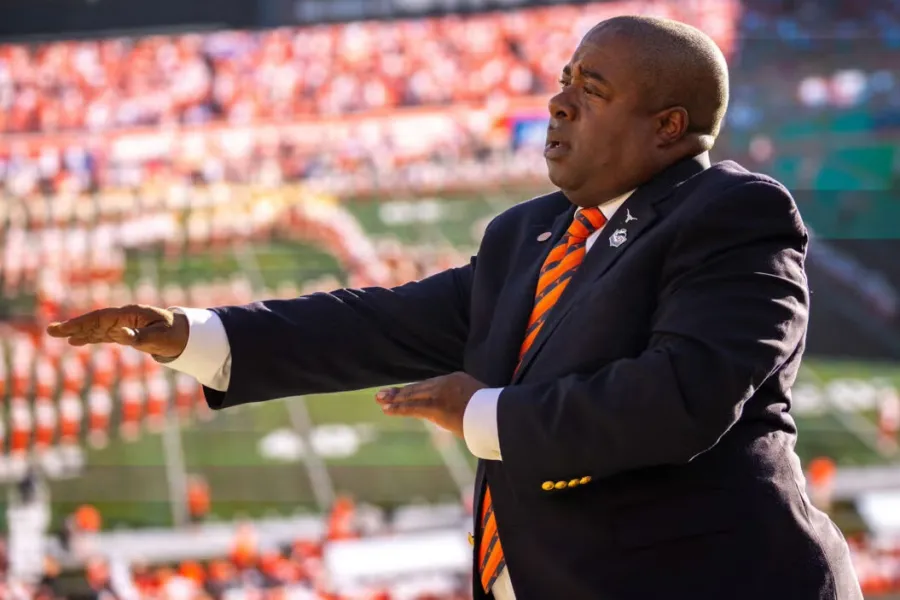 Clifton Croomes conducting a marching band