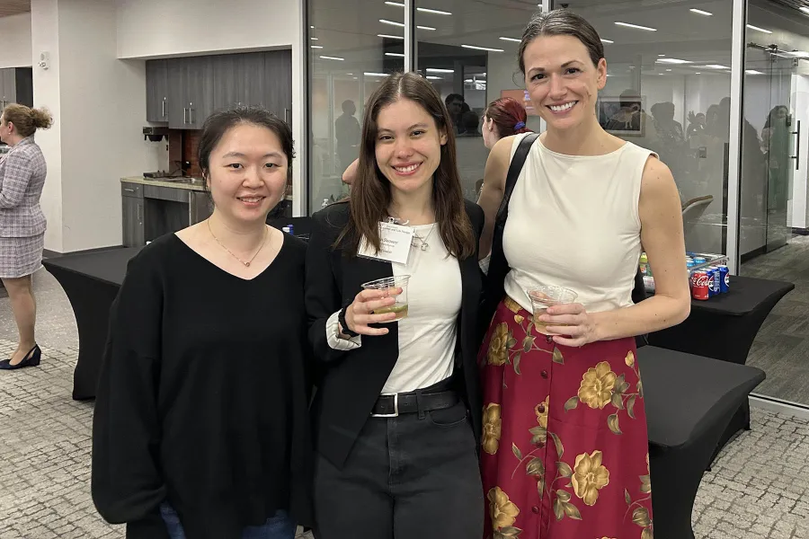 Three women smiling at the camera