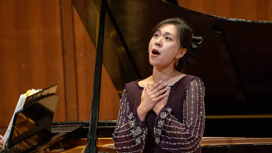 Opera Singer singing on stage at the Butler Opera International Competition
