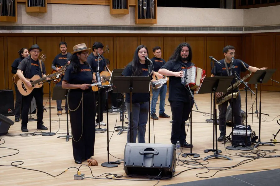 Conjunto ensemble playing on stage