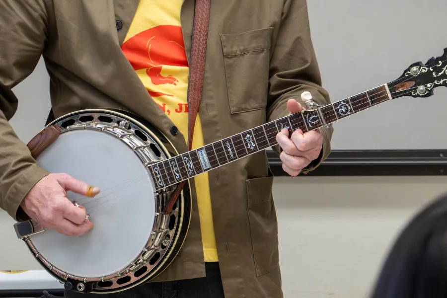 A person playing a banjo