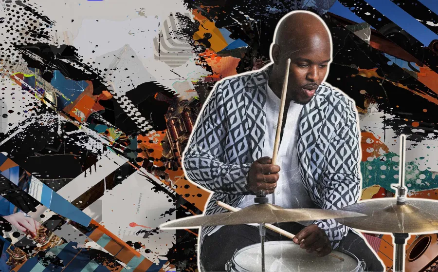 A publicity still of Ulysses Owens Jr. playing a drum set. 