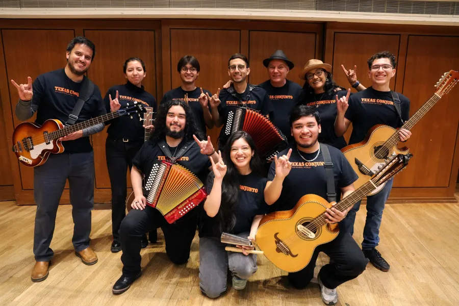 Conjunto ensembles pose with their instruments on the Bates Recital Hall Stage