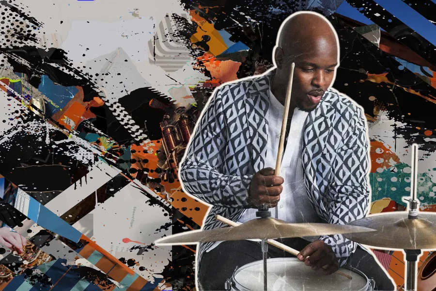 A publicity still of Ulysses Owens Jr. playing a drum set. 